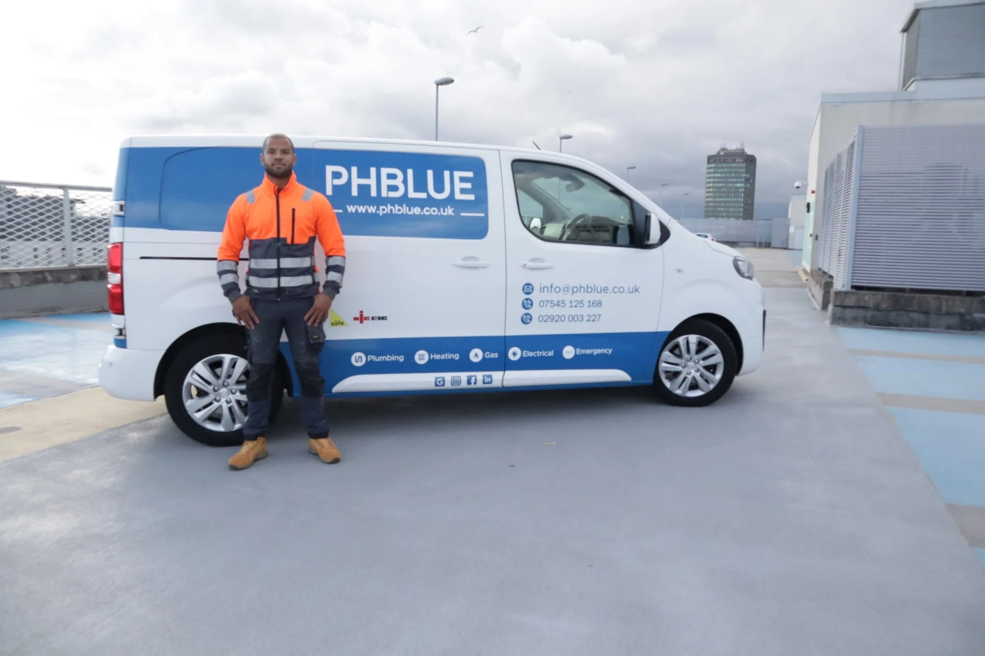 PHBLUE engineer with the branded PHBLUE van in Cardiff